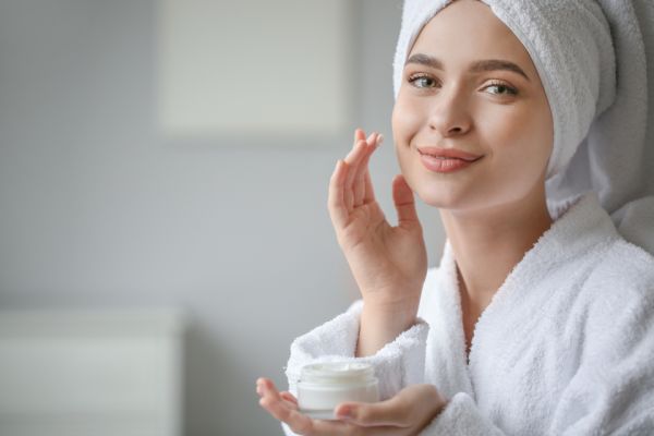 Woman receiving a skincare facial treatment at a spa